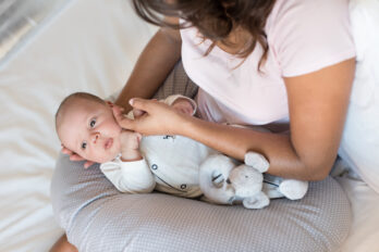 Baby sleeping in 2025 boppy pillow at night